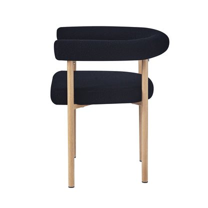 Ohio Curved Boucle Dining Chair Set of 2 in Black & Oak features a modern design with a tubular-shaped backrest, padded seat in black fabric, and slender light-wood legs, perfect for stylish dining spaces.