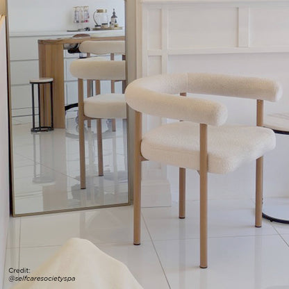 Ohio Curved Boucle Dining Chair Set of 2 in Cream & Oak, featuring a cream bouclé fabric with a curved backrest, supported by oak-finished legs, designed for minimalist dining spaces.