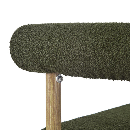 Close-up of Ohio Curved Bouclé Dining Chair Set of 2 in Green & Oak, showcasing olive-green bouclé upholstery on a tubular cushion and light-wood post, highlighting textural elegance and modern design.