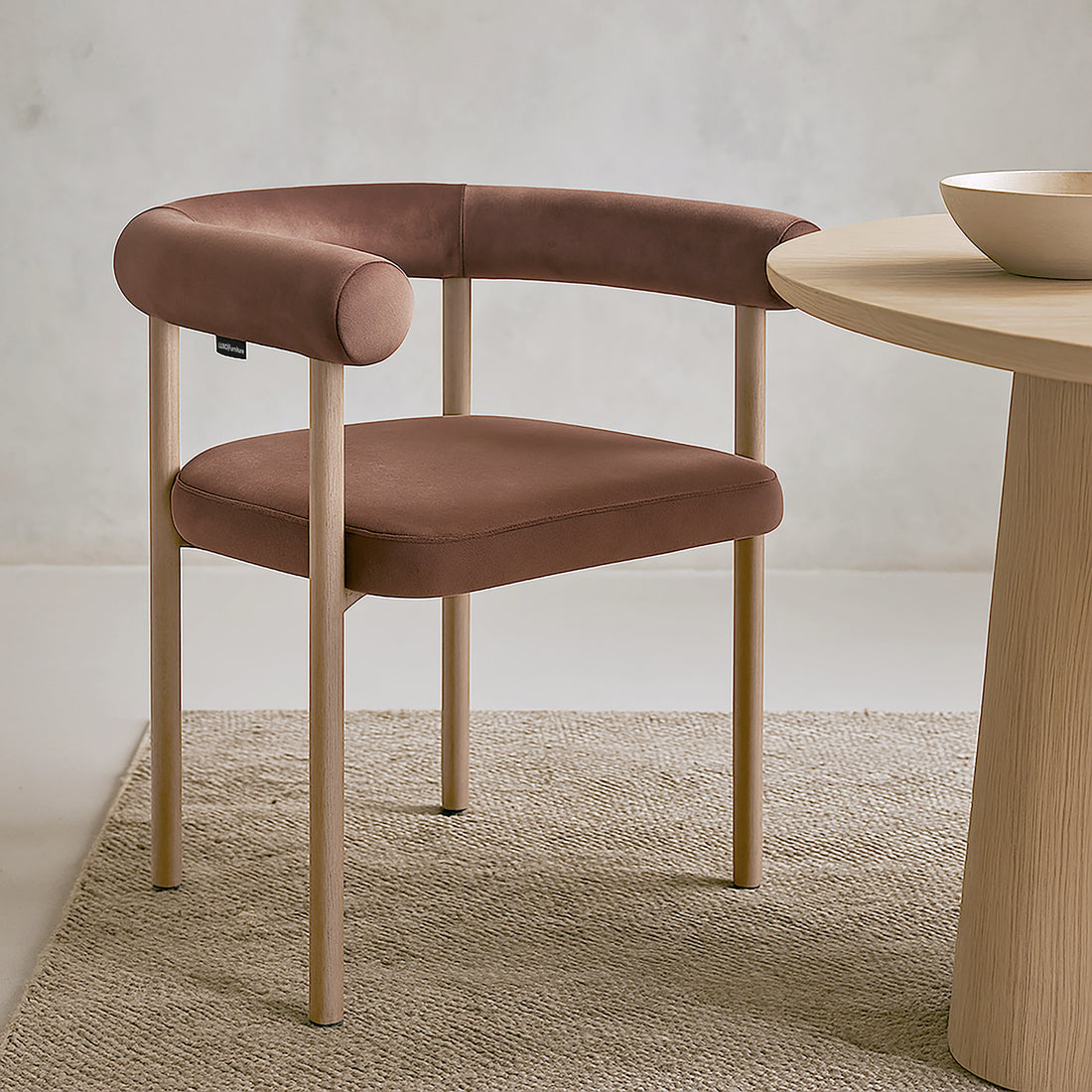 Ohio Velvet Dining Chair w/ Natural Legs Mocha Mousse Set of 2 features a curved brown faux leather backrest, matching cushion, and pale wooden legs, ideal for minimalist dining settings.