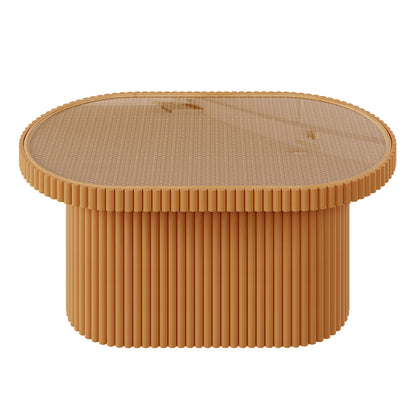 Close-up of the Olive Natural Rattan Side Coffee Table with a tempered glass top, showcasing its elegant honey finish and oval shape, highlighting its intricate rattan weave and compact design.