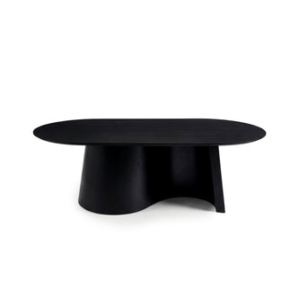 Full view of a black coffee table with oval top and sculptural curved base on a white background