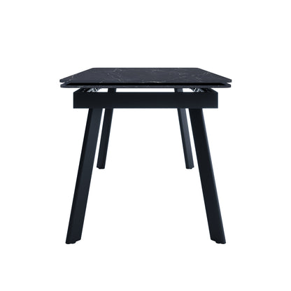 Rheed 197cm Extendable Ceramic Dining Table in Black, featuring a rectangular marble-effect top, angled square-section legs, and visible extendable hardware for adjustable size, combining modern style with practical functionality.