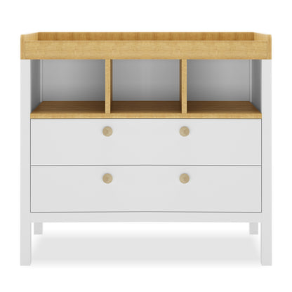 Rosella Solid Pine Baby Change Table in White features a low, two-drawer design with natural wood accents, three open cubbies, and a raised top for changing, blending style and practicality.
