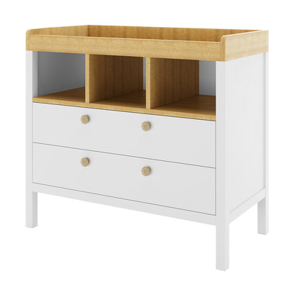 Rosella Solid Pine Baby Change Table with Drawers in White, featuring a natural-wood top with guard rails, two drawers, and three open cubbies, designed for practicality and modern style in a nursery.