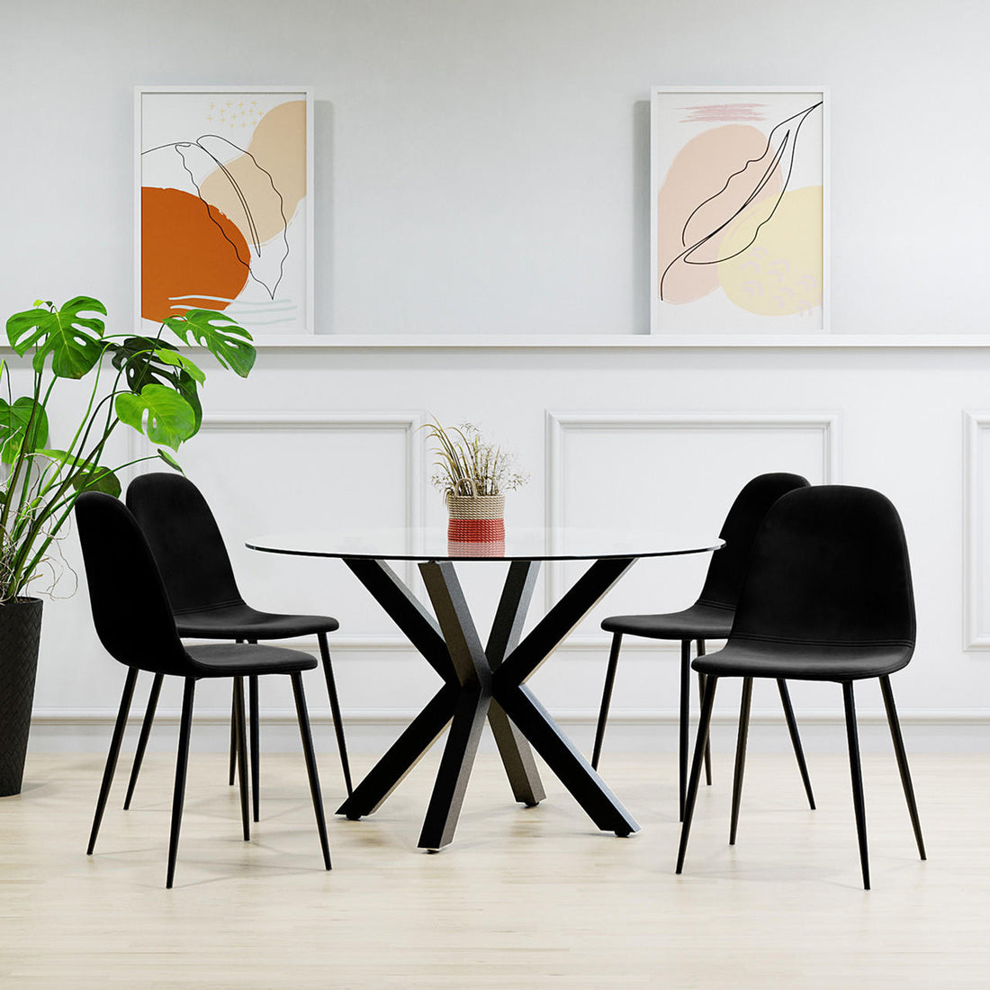 Rylee 120cm Black Round Table with 4 Halsa Chairs Dining Set, featuring a sleek round glass top with intersecting X-shaped metal supports, complemented by four cushioned high-backed velvet chairs.