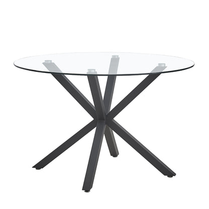 Rylee 120cm Black Round Table w/ 4 Halsa Chairs Dining Set features a sleek glass tabletop on X-shaped metal legs, paired with four cushioned velvet chairs offering a contemporary dining experience.