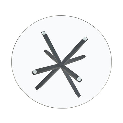 Rylee 120cm Black Round Table w/ 4 Halsa Chairs Dining Set features a round glass table with intersecting X-shaped metal legs, accompanied by four high-backed, cushioned velvet chairs.