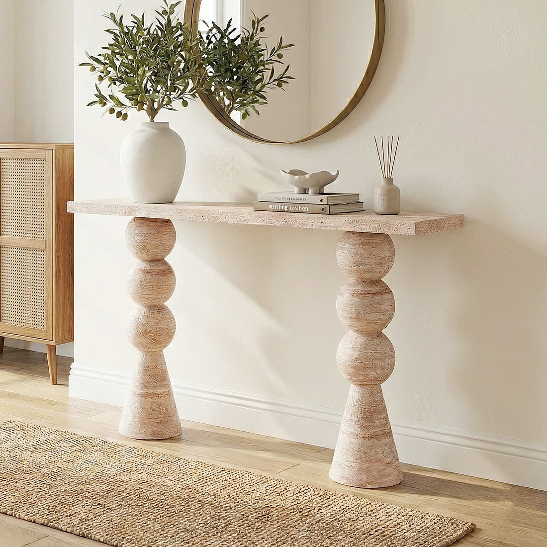 Sandford Modern Concrete Console Table - Travertine features a travertine-like finish with a smooth, rectangular top and a sculpted, round-shaped base, ideal for enhancing narrow spaces like hallways.