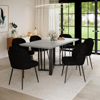 Scarlett Dining Chair Set of 6 in Black surrounds a rectangular table with a concrete-style top. The chairs feature scalloped backs, enhancing the modern dining room's elegant and contemporary ambiance.