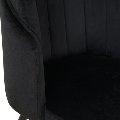 Close-up of Scarlett Velvet Dining Chair Set of 2 in Black, showcasing the plush velvety fabric on the cushioned backrest and curved armrest, highlighting luxurious comfort and modern design.