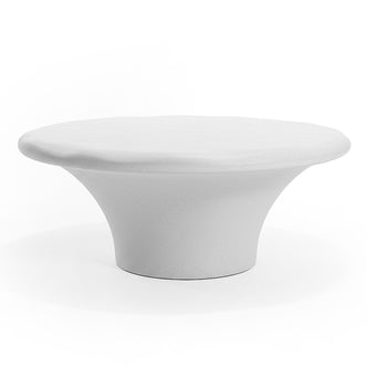 Modern sculptural coffee table on white background