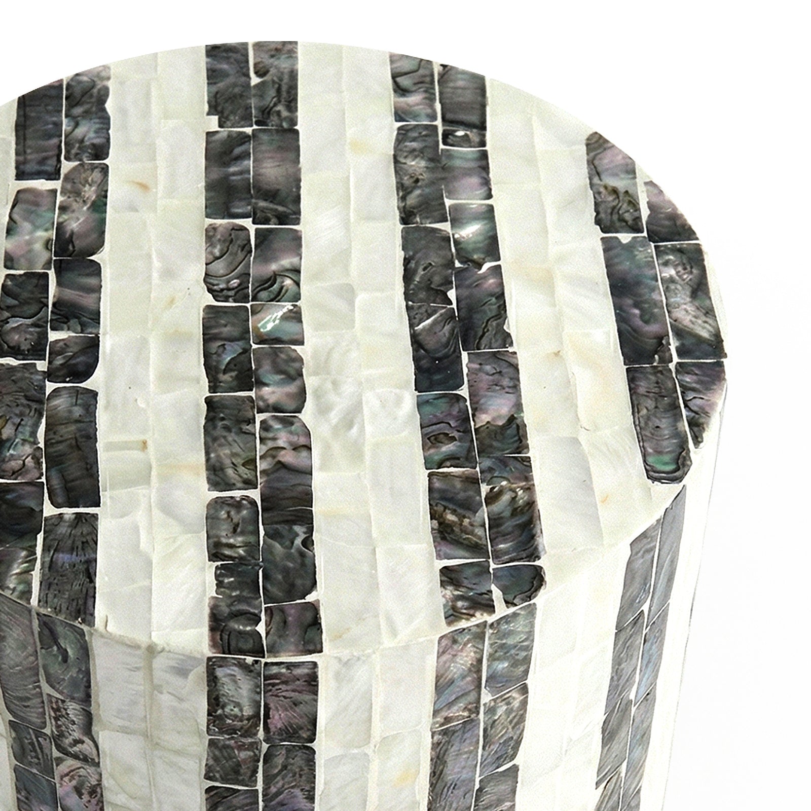 Close-up of cylindrical table’s mosaic inlay on white background