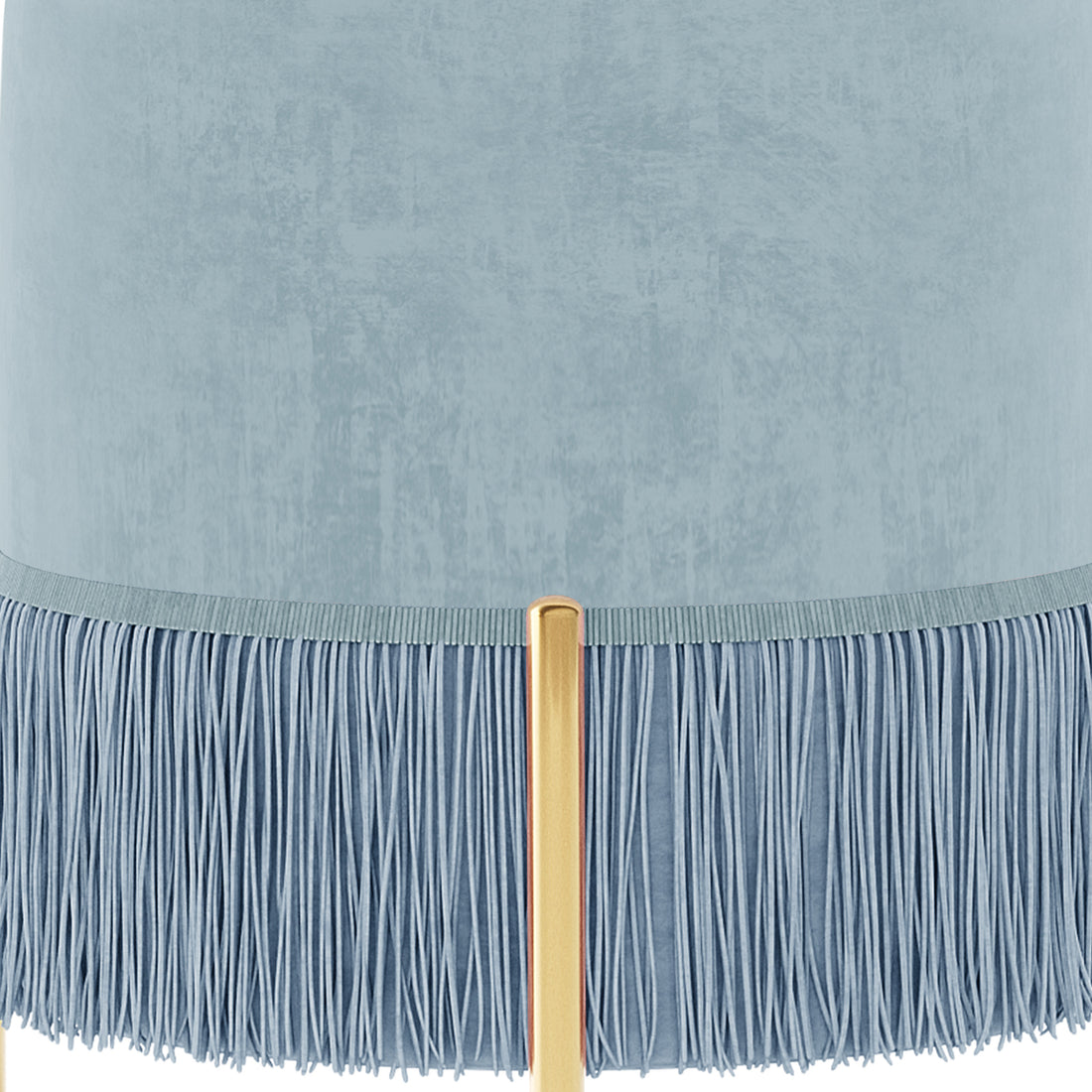 Stacey Tassled Velvet Ottoman Foot Stool in Blue, featuring a pale blue cylindrical lampshade with textured fabric, adorned with a fine blue fringe, and supported by a warm gold tubular lamp post.