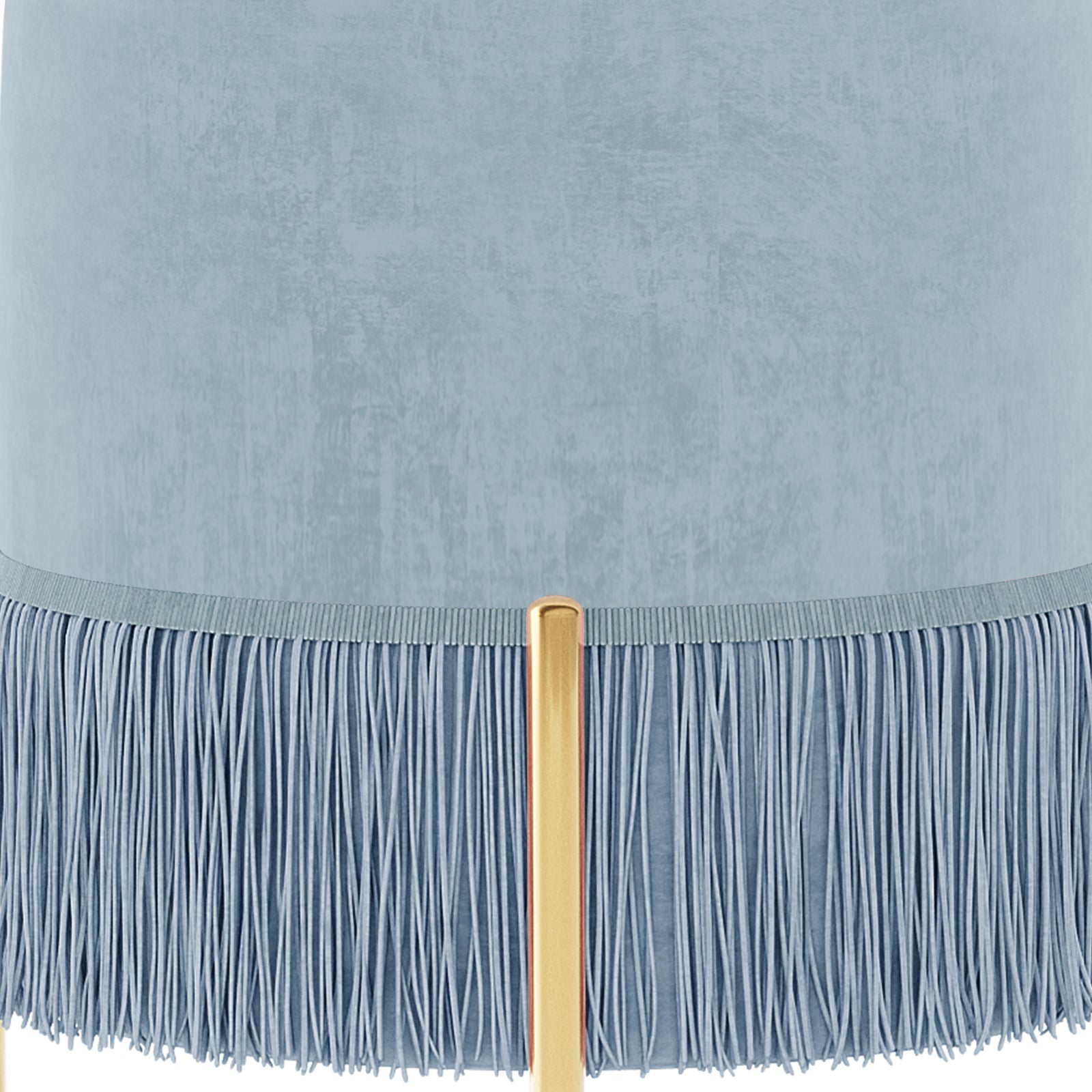 Stacey Tassled Velvet Ottoman Foot Stool in Blue, featuring a pale blue cylindrical lampshade with textured fabric, adorned with a fine blue fringe, and supported by a warm gold tubular lamp post.