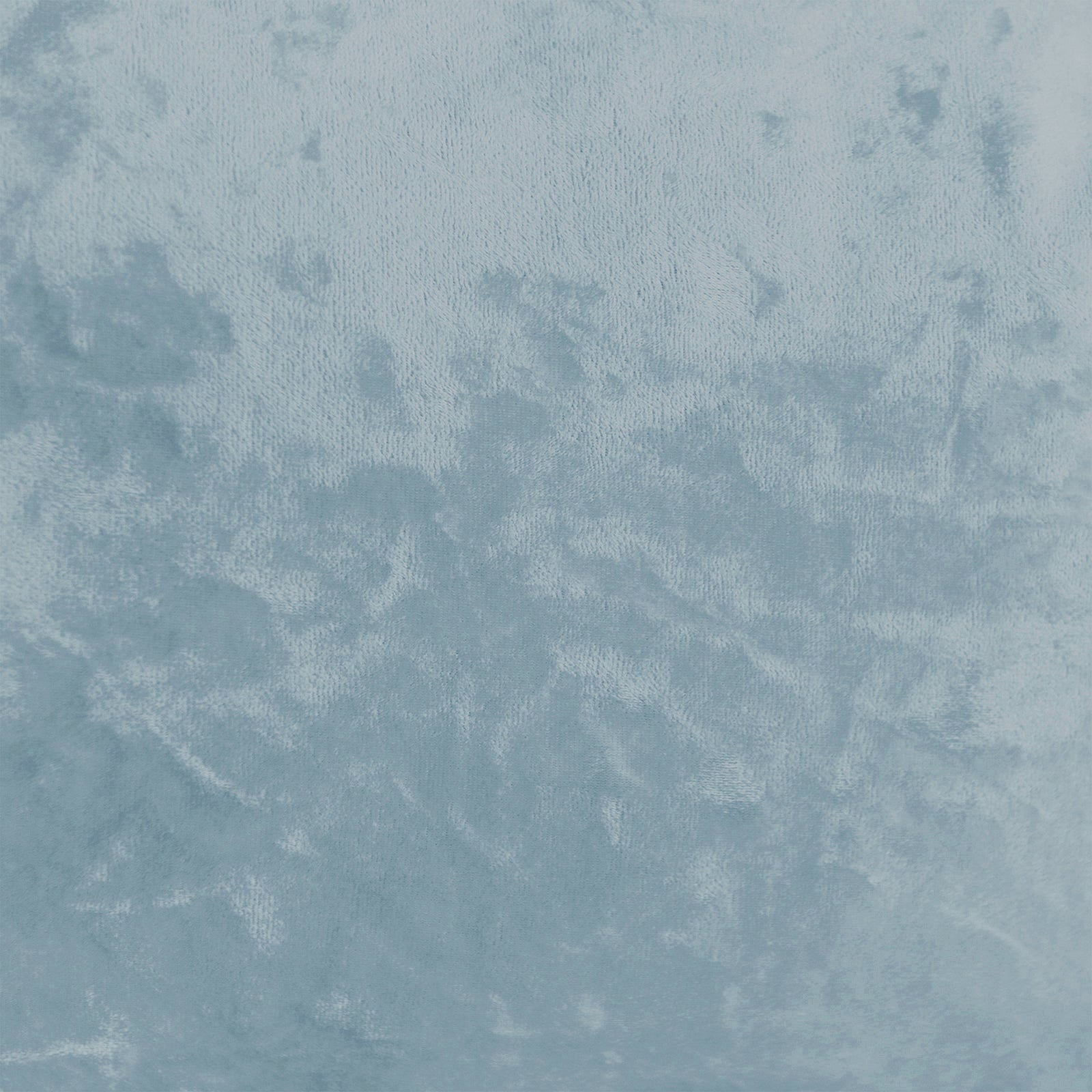 Close-up of Stacey Tassled Velvet Ottoman Foot Stool in Blue, showcasing the plush, light-blue velvet texture with a gentle sheen, highlighting its intricate fringe tassel detailing and luxurious fabric.