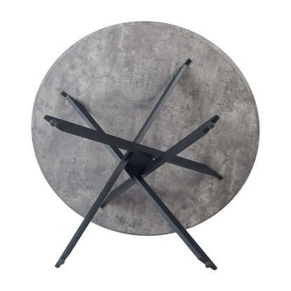 Stoten Round Dining Table Concrete with a round top and black tapered legs, showcasing a contemporary design. The table rests on a concrete surface, embodying modern elegance and stability.