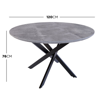 Stoten Round Dining Table Concrete features a round top with a concrete finish and black powder-coated legs that cross and taper outward, creating a modern, sturdy design ideal for various settings.