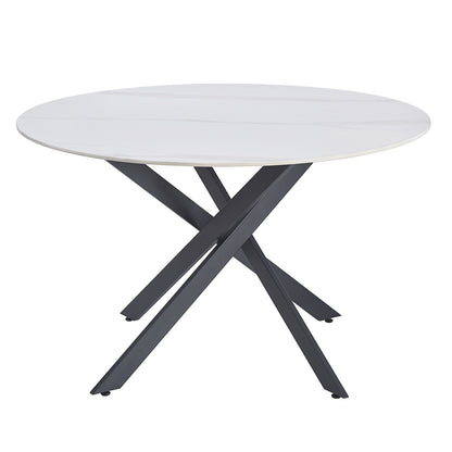 Stoten Round Dining Table White Marble with a sleek, marble-style top and intersecting black metal X-shaped legs, showcasing a modern design that seats four, ideal for contemporary dining spaces.