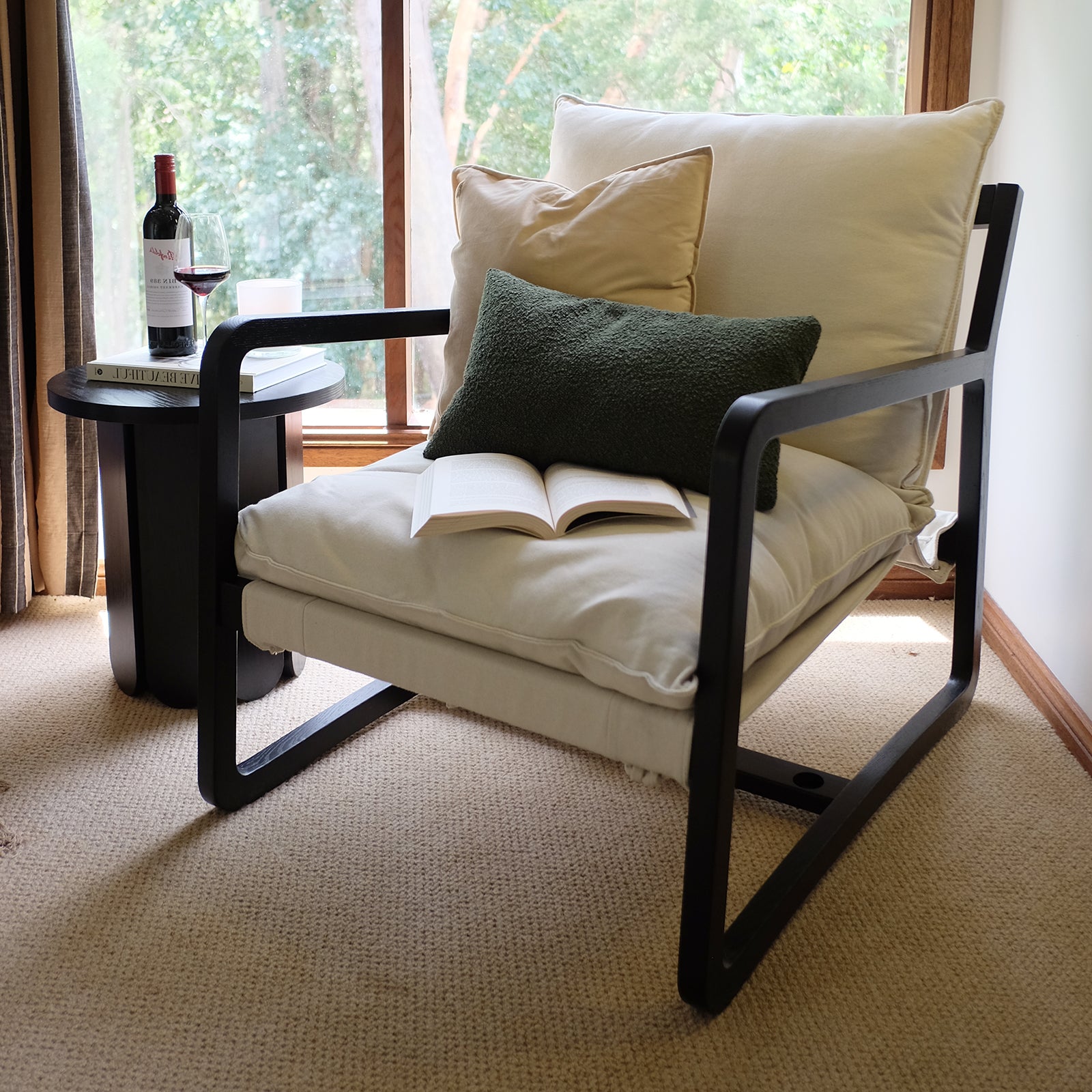 Tilly Linen Hardwood Arm Chair Black featuring a sleek oak frame and plush cushions, displayed in an elegant indoor setting, emphasizing its modern farmhouse style and superior comfort.