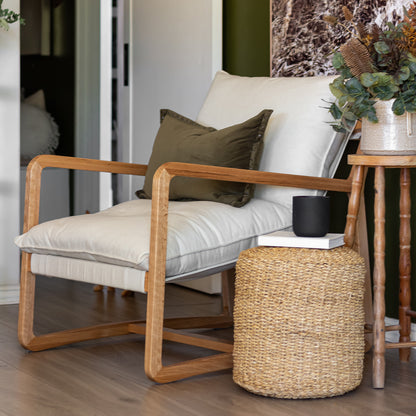 Close-up of the Tilly Linen Hardwood Arm Chair showcasing its elegant minimalist design, featuring high-density foam cushions on a sturdy oak frame, ideal for modern interiors.