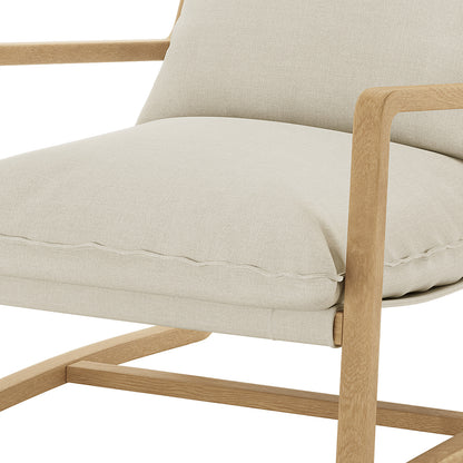 Tilly Linen Hardwood Arm Chair Natural, showcasing a close-up of its plush cushion and solid oak armrest, highlighting its minimalist design and superior craftsmanship for modern living spaces.