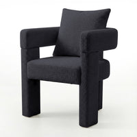 Utah Bouclé Curved 3 Legged Accent Chair in Black with plush bouclé upholstery, squared padded seat, thick tubular armrests