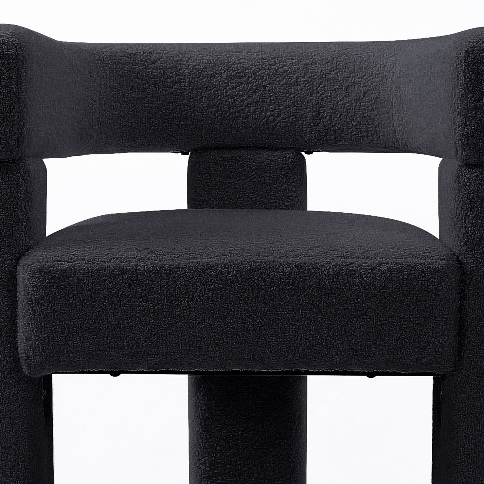 Utah Bouclé Curved 3 Legged Accent Chair in Black featuring a squared, padded seat, matching tubular support, and a high backrest, showcasing its modern design and plush upholstery.