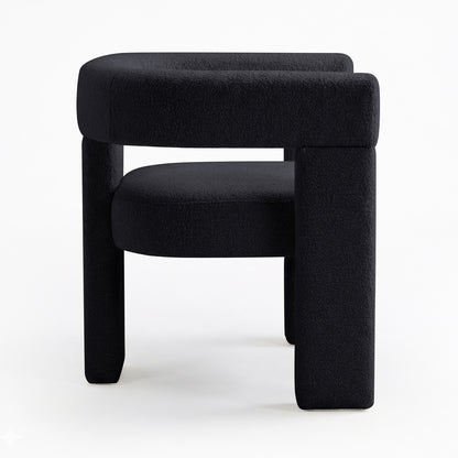 Utah Boucle Curved 3 Legged Accent Chair in Black, featuring a sculptural design with boucle-style fabric, low rounded seat, backrest, and distinctive chunky legs for modern elegance and comfort.