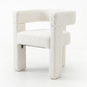 Utah Bouclé Curved 3 Legged Accent Chair in Cream, showcasing a minimalist design with plush off-white boucle upholstery, chunky armrests, and a unique three-legged form for a stylish, modern touch.