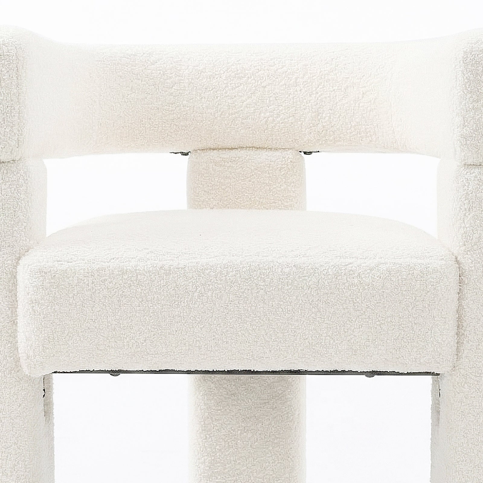 Utah Bouclé Curved 3 Legged Accent Chair in Cream features a close-up of its white boucle upholstery, showing a thick seat cushion and tubular backrest support, highlighting its modern design.