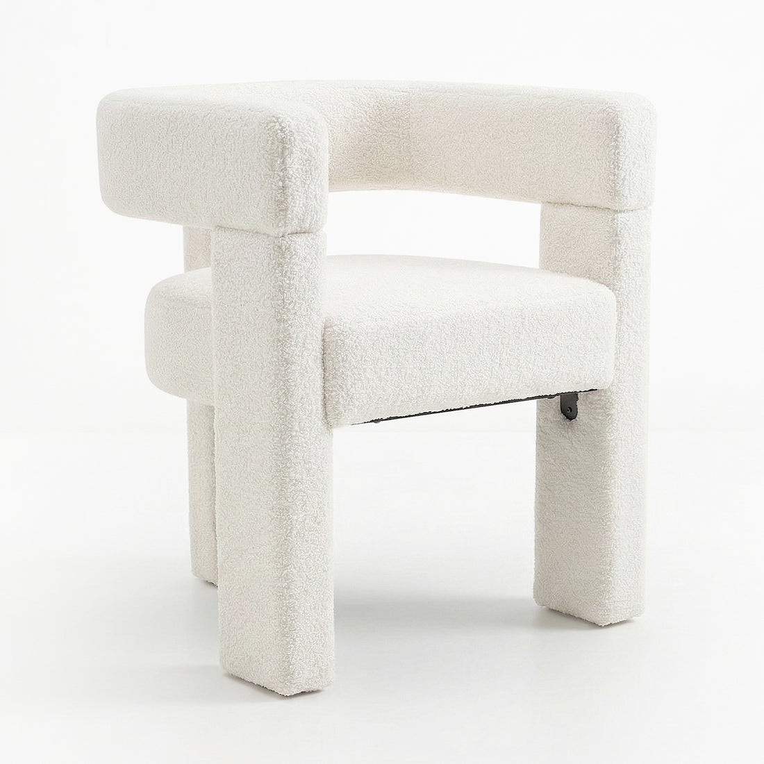 Utah Bouclé Curved 3 Legged Accent Chair in Cream features a chunky, curved backrest and unique three-legged design, upholstered in soft, textured bouclé fabric, offering sophisticated style and ergonomic comfort.