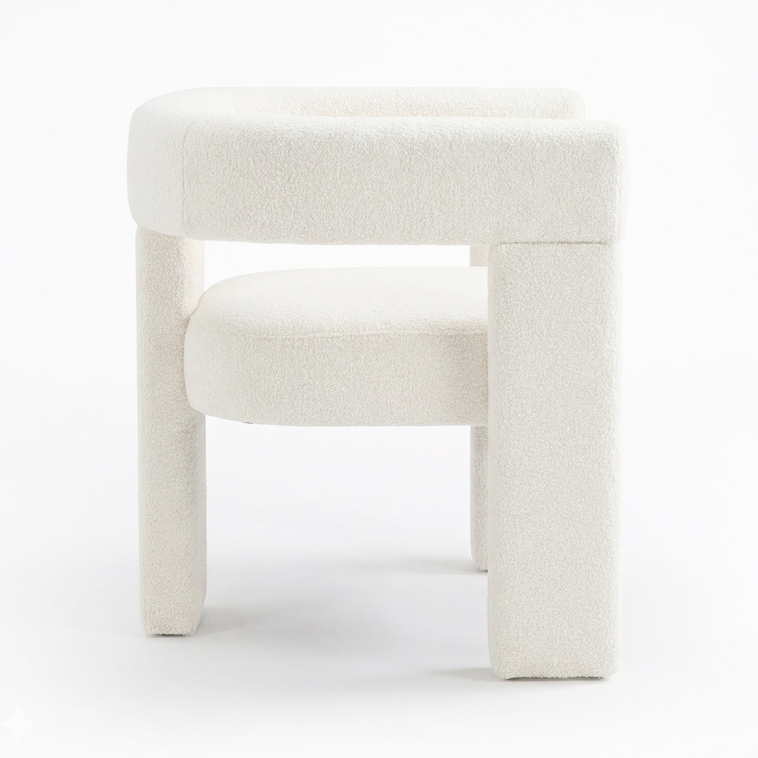 Utah Boucle Curved 3 Legged Accent Chair in Cream showcases a modern design with off-white boucle upholstery, a rounded backrest, circular seat cushion, and distinctive chunky tubular legs for a minimalist look.