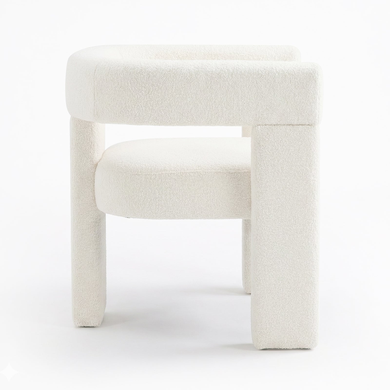 Utah Boucle Curved 3 Legged Accent Chair in Cream showcases a modern design with off-white boucle upholstery, a rounded backrest, circular seat cushion, and distinctive chunky tubular legs for a minimalist look.