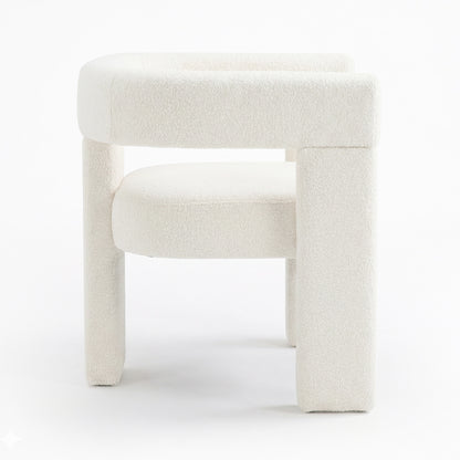 Utah Boucle Curved 3 Legged Accent Chair in Cream showcases a modern design with off-white boucle upholstery, a rounded backrest, circular seat cushion, and distinctive chunky tubular legs for a minimalist look.