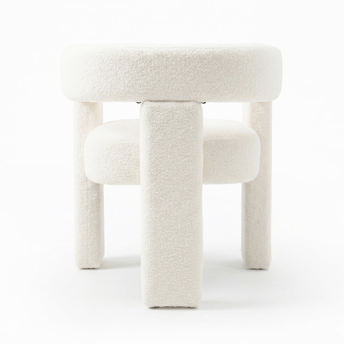 Utah Bouclé Curved 3 Legged Accent Chair in Cream, featuring a round cushioned top, thick padded legs, and luxurious off-white bouclé upholstery, showcasing a bold, modern silhouette.