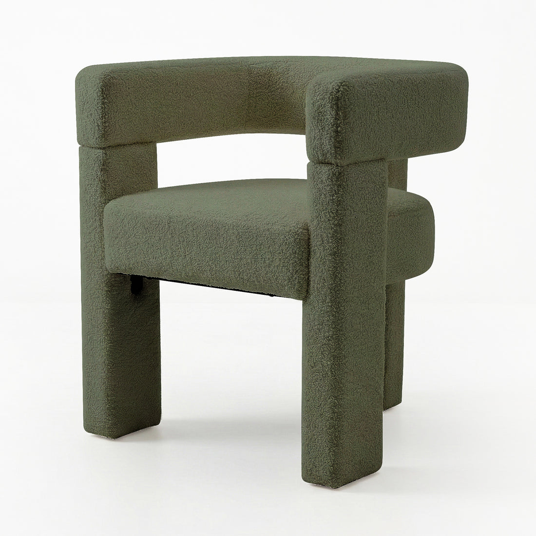 Utah Boucle Curved 3 Legged Accent Chair in Green, featuring a sculptural design with boucle upholstery, squared-off legs, and a wide, curved seat, showcasing modern elegance and comfort.