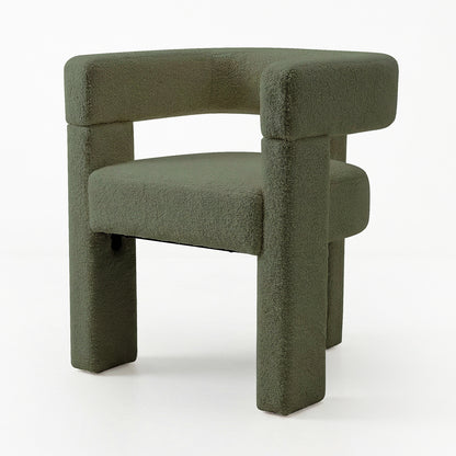 Utah Boucle Curved 3 Legged Accent Chair in Green, featuring a sculptural design with boucle upholstery, squared-off legs, and a wide, curved seat, showcasing modern elegance and comfort.