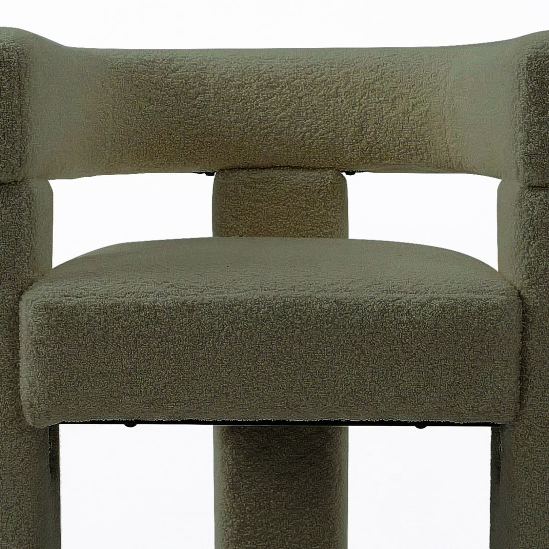 Close-up of the Utah Bouclé Curved 3 Legged Accent Chair in Green, showcasing its textured neutral-tone fabric upholstery, padded seat, and modern cylindrical support legs for stylish and ergonomic comfort.