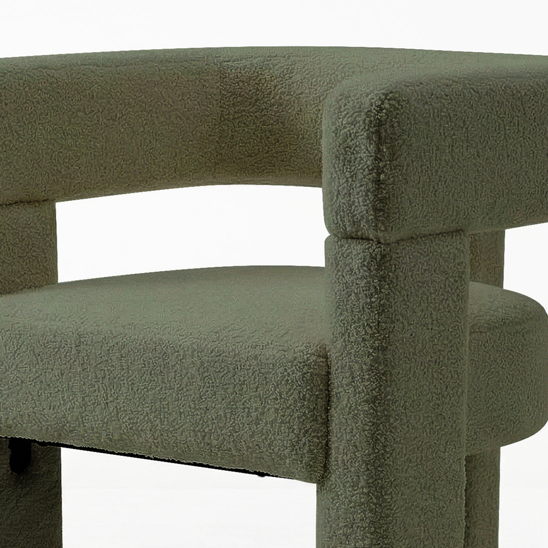 Utah Bouclé Curved 3 Legged Accent Chair in Green, featuring a textured gray-green fabric, rounded seat cushion, and curved backrest with high armrests, supported by chunky cylindrical legs for a modern look.