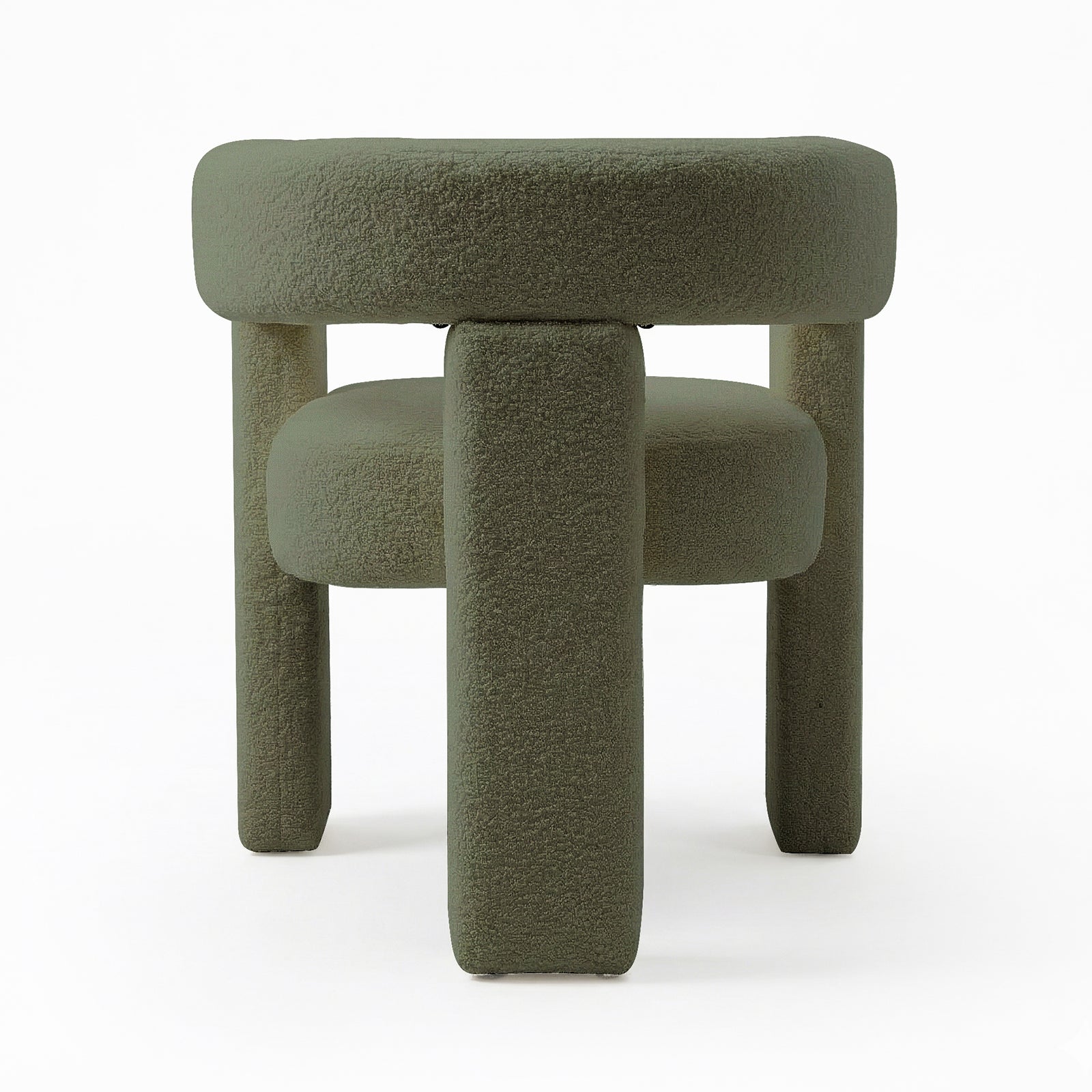 Utah Bouclé Curved 3 Legged Accent Chair in Green, featuring a plush, round cushioned top and four chunky cylindrical legs, all upholstered in muted green bouclé fabric, creating a modern, minimalist look.
