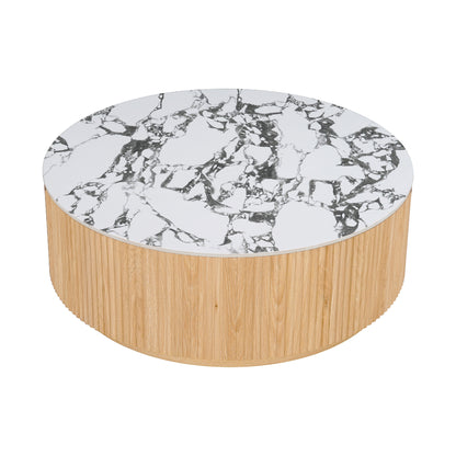 Round coffee table with marble top and grooved wood base on white background