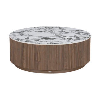 Round coffee table with wood veneer cylindrical base and white marble-look top on white background