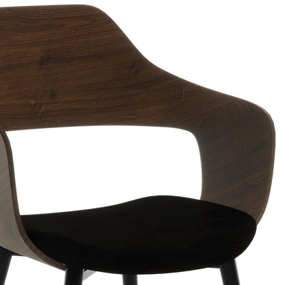 Winfield Curved Wooden Back Velvet Dining Chair Black Set of 2 features a sleek design with a smoothly curved wooden back, plush velvet upholstery, and ergonomic armrests, showcasing elegant craftsmanship.