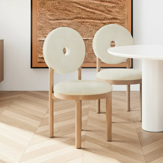Wubin Boucle Hardwood Dining Chair Set of 2 in Cream White features light wood frames, plush upholstered seats, circular donut backrests, and complements a round table with a fluted base.