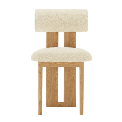 Close-up of Wylie Boucle Oak Dining Chair Set, highlighting plush boucle upholstery and solid oak frame with elegant wood accents and anti-slip pads.