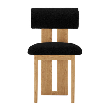 Front view of Wylie Boucle Oak Dining Chair Black Set of Two features plush boucle upholstery, solid oak legs, and a cushioned seat for modern dining comfort and style.