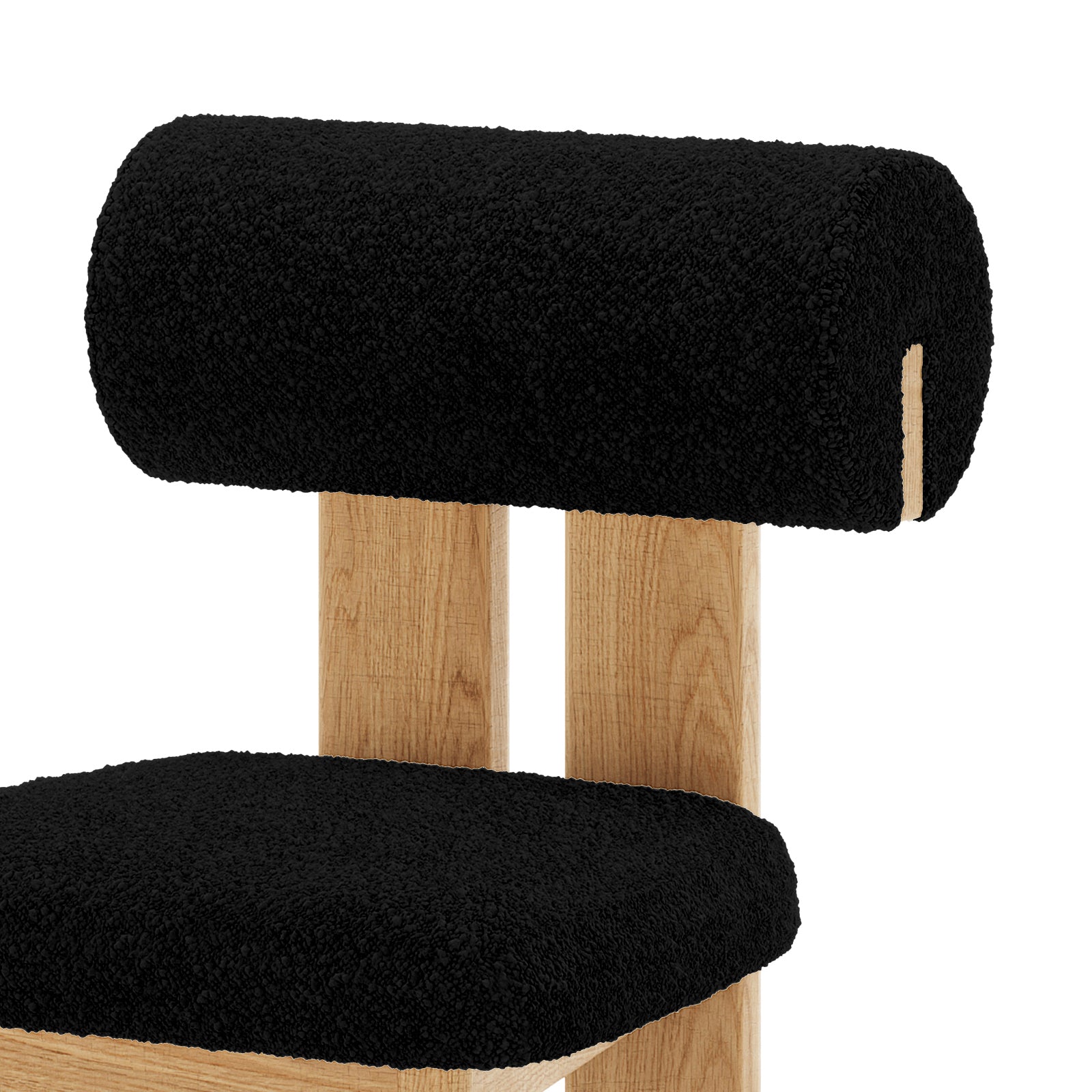 Close up of Wylie Boucle Oak Dining Chair Black Set of Two, featuring plush boucle upholstery, wooden legs, and a cushioned seat for modern dining comfort
