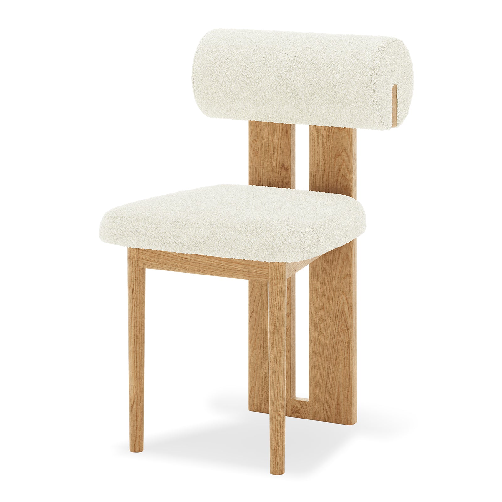 Close-up of Wylie Boucle Oak Dining Chair, showcasing plush boucle fabric on cushioned seat and backrest, with solid oak frame and paneled legs, highlighting elegant and comfortable dining seating.