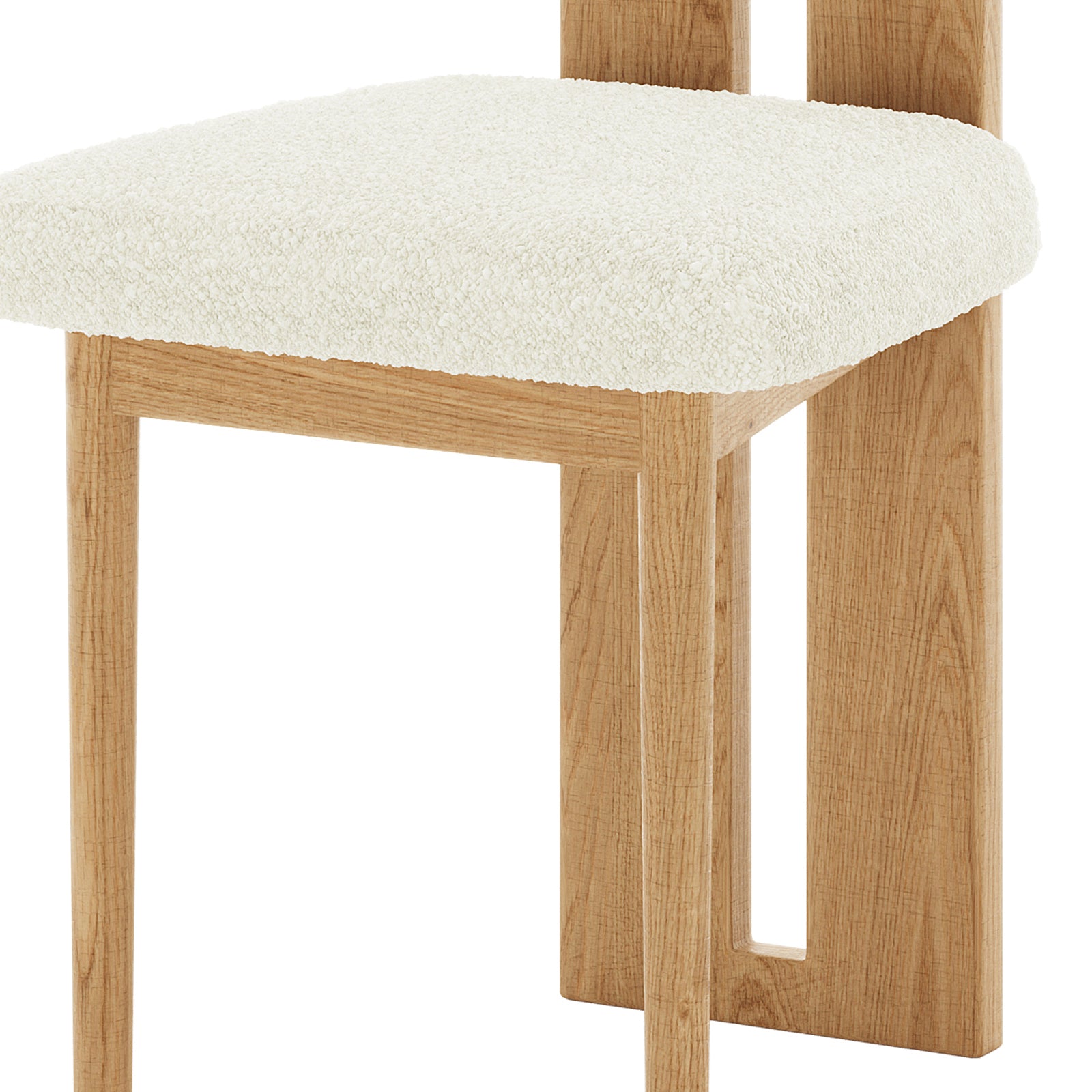 Close-up of Wylie Boucle Oak Dining Chair Cream White Set of Two, featuring a plush boucle fabric upholstery and solid American oak frame, showcasing a blend of comfort and modern design.